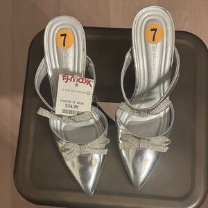 BCBGeneration Silver Pointed Slingback Heels with Crystal Bow Accents